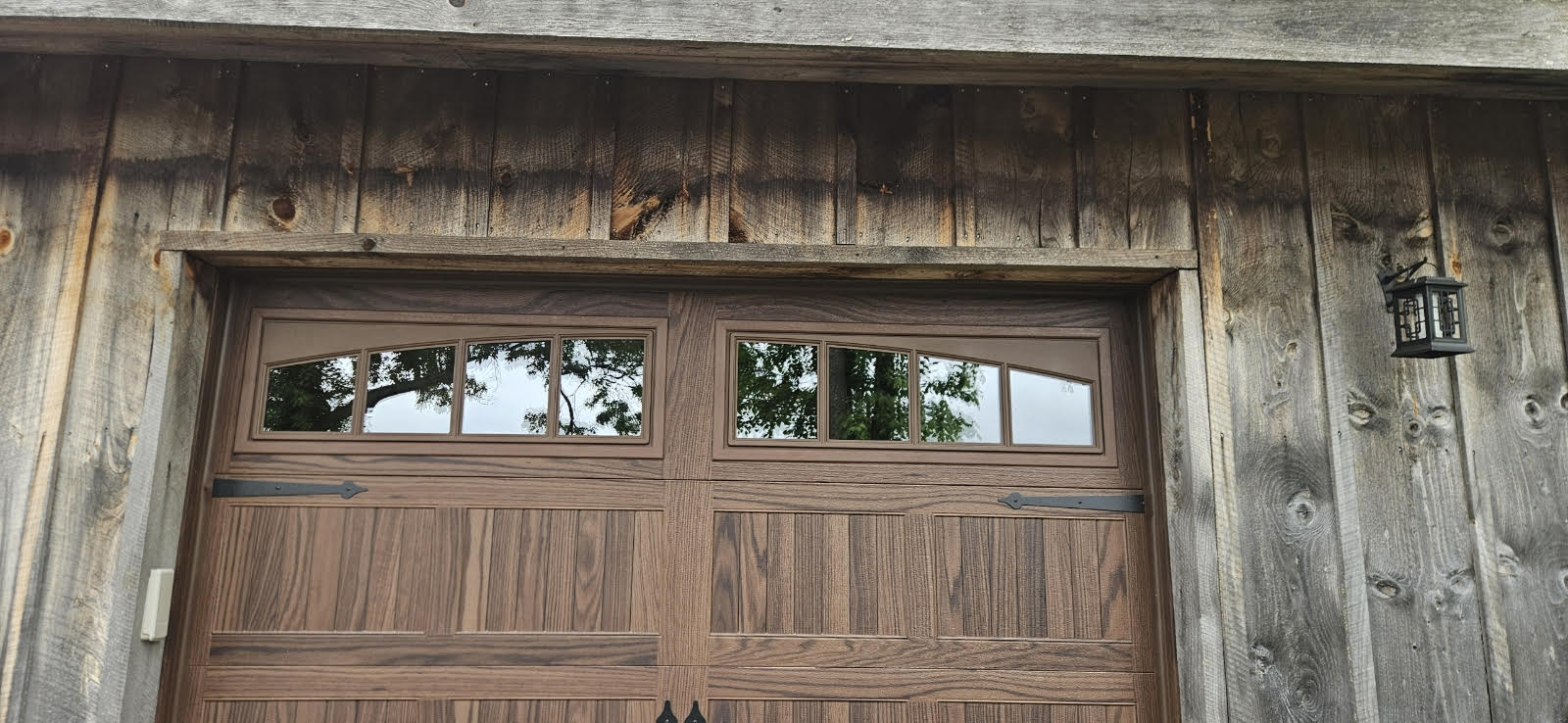 wooden garage door to go along with wooden siding on home