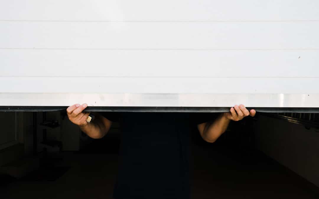 man with hands holds pvc garage door